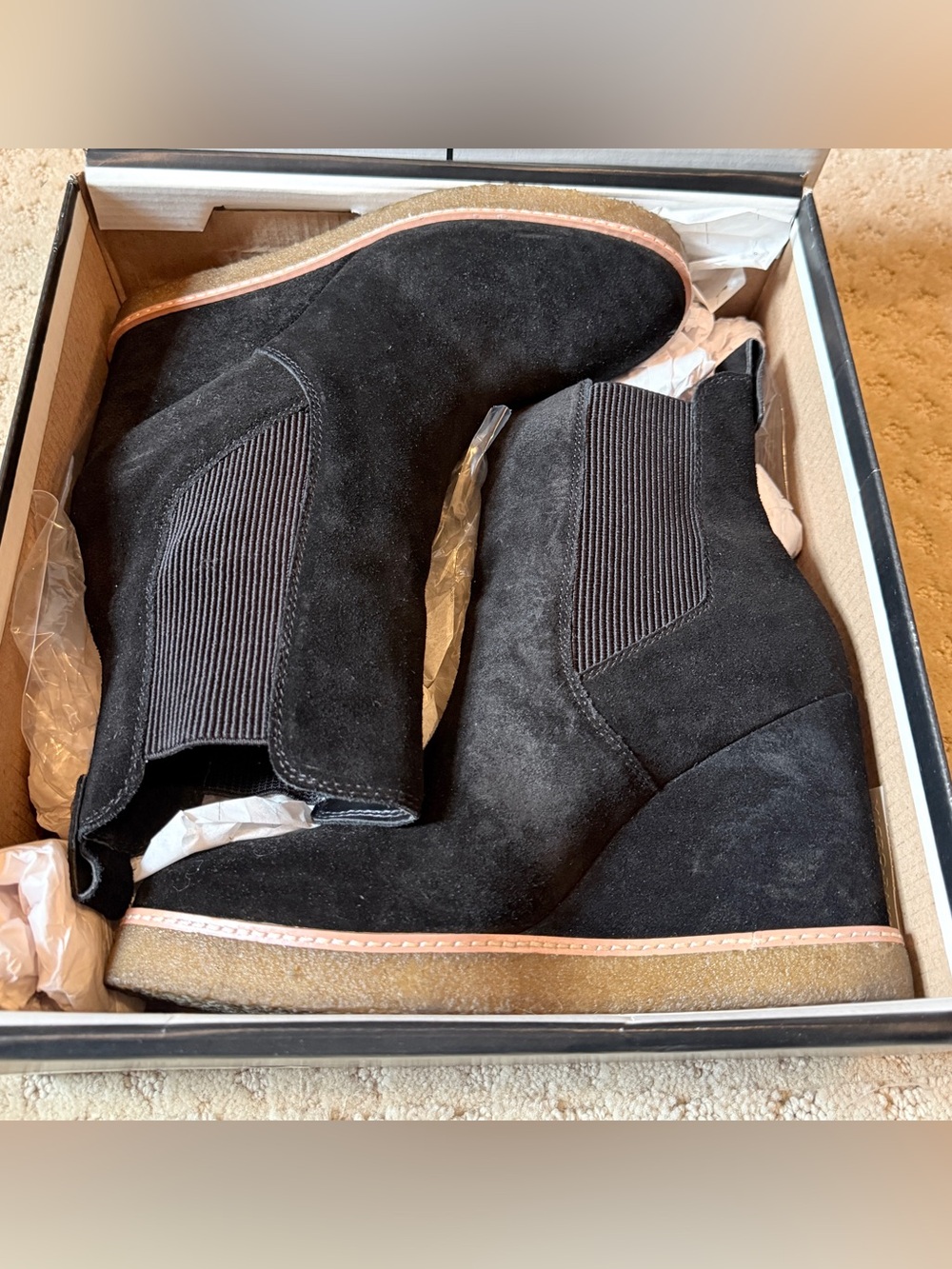 Women’s black suede Steve Madden Mooris wedge bootie.